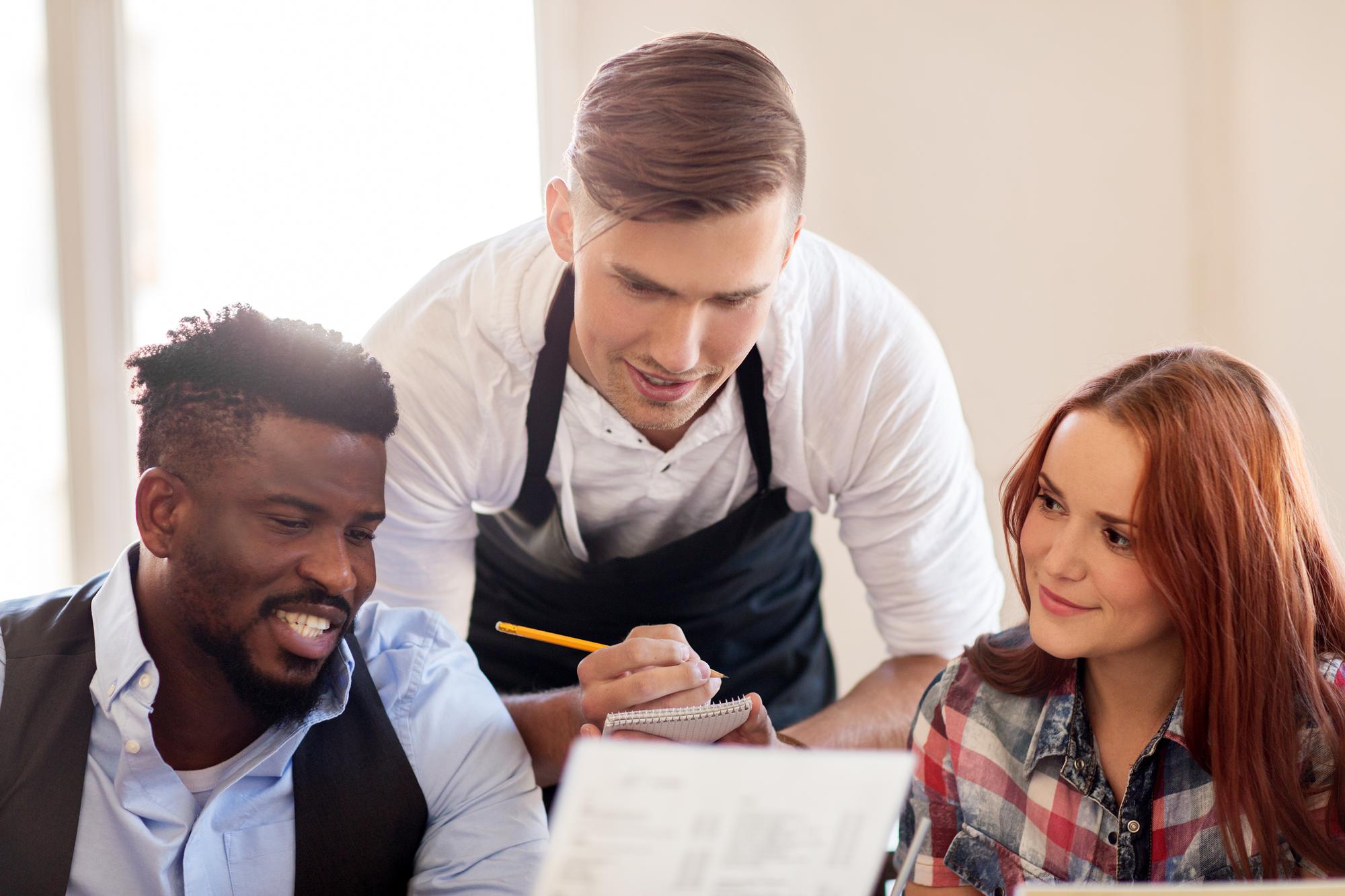 Workshop with chefs discussing menu cards
